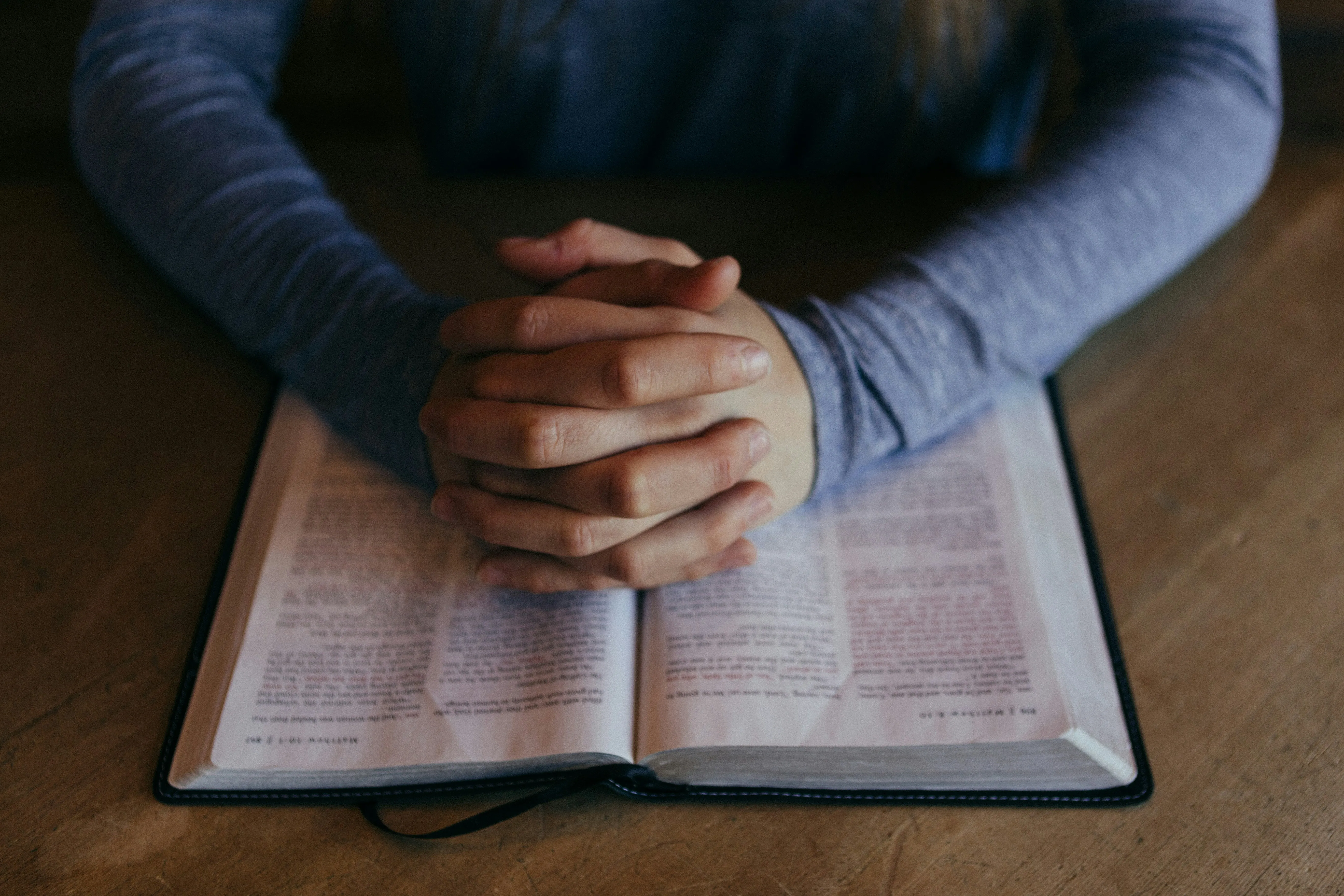 Praying hands — the posture of a worship leader before service begins