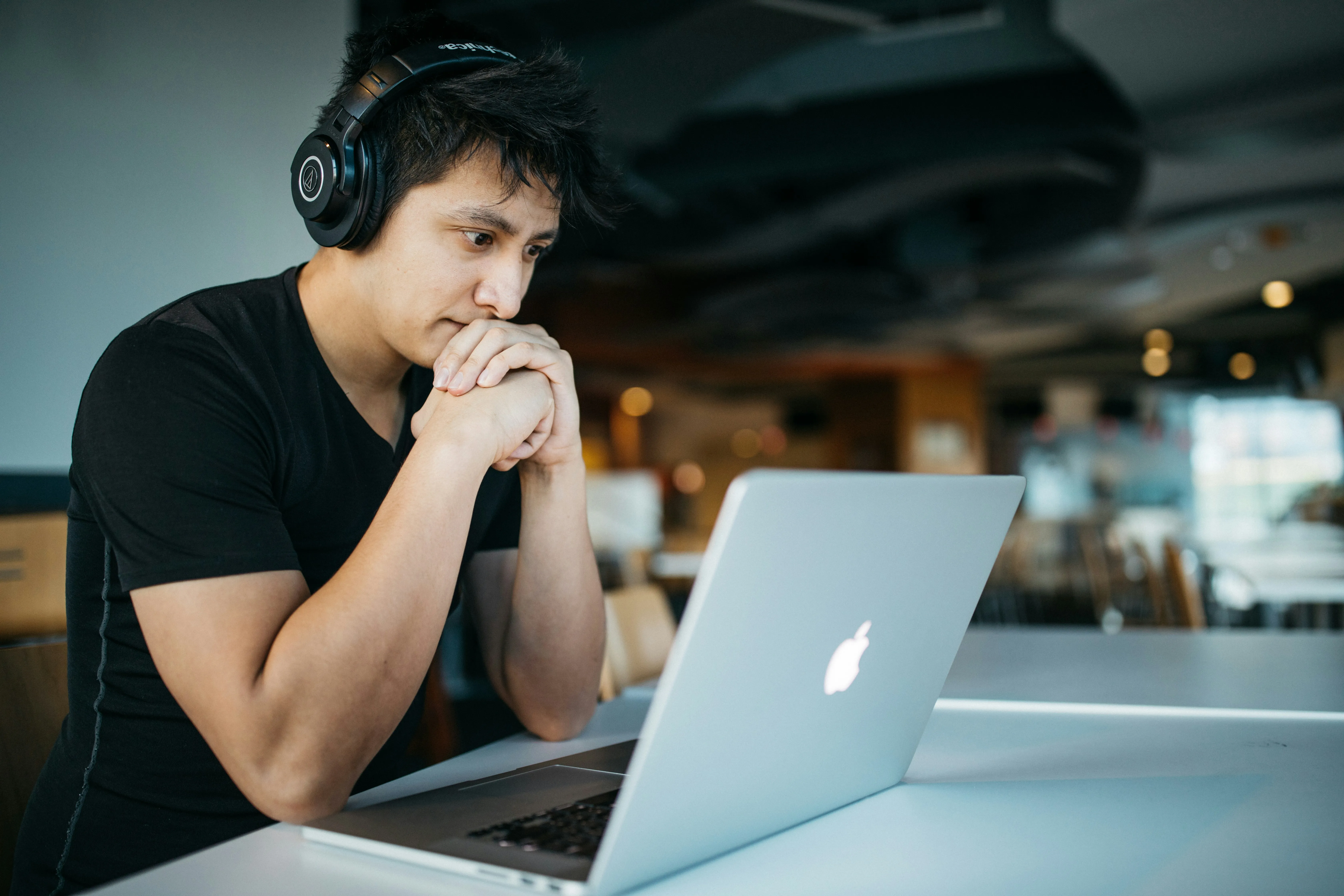 A man studying with headphones and a laptop — the YouTube tutorials that filled in the gaps between rehearsals