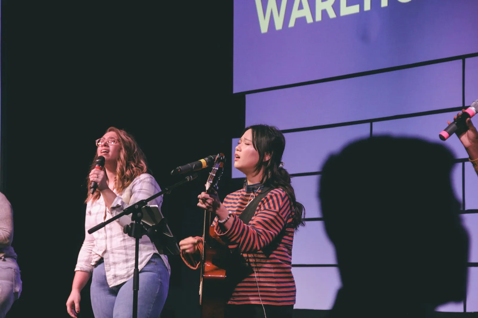 Vocalists on a worship stage — the songs that carry a congregation regardless of how full the band behind them is